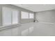 Bright living area featuring large windows and marble tile floors at 9950 W 17Th Ave, Lakewood, CO 80215