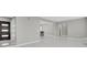 Bright, open-concept living area with contemporary tile flooring and neutral wall colors at 9950 W 17Th Ave, Lakewood, CO 80215