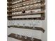Stylish wine storage solution with wooden shelves designed to hold both bottles and glasses at 9950 W 17Th Ave, Lakewood, CO 80215