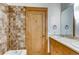 This bathroom features a tile shower and a modern sink with natural wood cabinetry at 1465 S Pearl St # 6, Denver, CO 80210