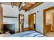 Bright bedroom showcasing wood ceiling, open doors leading to other areas, a dresser and neutral walls at 1465 S Pearl St # 6, Denver, CO 80210