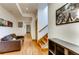 Long hallway with stairs and decoratively framed wall art at 1465 S Pearl St # 6, Denver, CO 80210