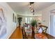 Dining room with hardwood floors, a wooden table, and stylish decor at 1834 S Oakland St, Aurora, CO 80012