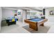 Finished basement with pool table, ping pong table and seating area for entertainment at 5373 E Links Cir, Centennial, CO 80122