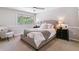 Comfortable bedroom with plush bed, neutral walls, ceiling fan, and bright window at 5373 E Links Cir, Centennial, CO 80122