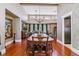 Spacious dining room with hardwood floors, elegant decor, and ample seating for gatherings at 5373 E Links Cir, Centennial, CO 80122