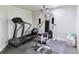 Home gym with a treadmill and multi-station weight machine, creating the perfect workout space at 5373 E Links Cir, Centennial, CO 80122