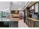 Stylish kitchen with stainless steel appliances, granite countertops, and ample cabinet space at 5373 E Links Cir, Centennial, CO 80122
