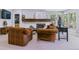 Relaxing living room features a fireplace, large windows, and cozy seating area at 5373 E Links Cir, Centennial, CO 80122
