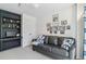 Cozy living room featuring comfortable seating, built-in shelving, and decor at 5373 E Links Cir, Centennial, CO 80122
