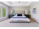 Spacious main bedroom with tray ceilings, large windows, plush carpet, and stylish decor at 5373 E Links Cir, Centennial, CO 80122
