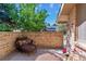 Cozy outdoor patio with brick privacy wall and comfortable seating, perfect for relaxation at 5373 E Links Cir, Centennial, CO 80122