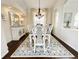 Elegant dining room featuring a decorative chandelier and a neutral-toned area rug at 6561 Ocaso Dr, Castle Pines, CO 80108