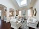 Cozy living room bathed in natural light showcases comfortable seating and stylish decor at 6561 Ocaso Dr, Castle Pines, CO 80108