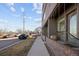 Townhome exterior with sidewalk view and city skyline in the background at 3927 Inca St, Denver, CO 80211