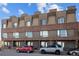 View of the exterior of the townhome featuring brick and siding at 3927 Inca St, Denver, CO 80211