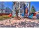 Backyard patio featuring an outdoor seating area with blue chairs and a shade umbrella at 19346 E Prentice Ln, Centennial, CO 80015