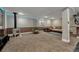 Finished basement with carpet, potlights, and a comfortable seating area at 19346 E Prentice Ln, Centennial, CO 80015