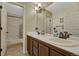 Bright bathroom with a double vanity and tile flooring, providing a functional space for daily routines at 19346 E Prentice Ln, Centennial, CO 80015