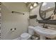 Bathroom featuring a pedestal sink, decorative fixtures, and a toilet at 19346 E Prentice Ln, Centennial, CO 80015