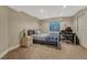 Cozy carpeted bedroom featuring a window, desk, and a comfortable bed at 19346 E Prentice Ln, Centennial, CO 80015