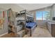 Cozy bedroom features a unique bunk bed with storage and a window offering natural light at 19346 E Prentice Ln, Centennial, CO 80015