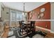 Bright dining area with hardwood floors, decorative wall plates, and a wooden table set for six at 19346 E Prentice Ln, Centennial, CO 80015