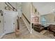 Inviting entryway with staircase and adjacent living area, displaying great natural light at 19346 E Prentice Ln, Centennial, CO 80015
