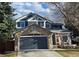 Charming two-story home with a stone-accented garage and inviting front porch at 19346 E Prentice Ln, Centennial, CO 80015