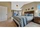 Spacious main bedroom with a large bed and a view of the outdoors at 19346 E Prentice Ln, Centennial, CO 80015