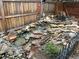 Custom backyard water feature with natural stones, pump, water fall, and decorative garden gnome at 19346 E Prentice Ln, Centennial, CO 80015
