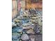 Backyard rock garden with antique water pump and water feature at 19346 E Prentice Ln, Centennial, CO 80015