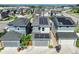 Up close aerial view of new two-story homes with solar panels and attached garages at 6940 Clay St, Denver, CO 80221