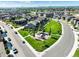Aerial view of a suburban neighborhood with a community playground and green space at 6940 Clay St, Denver, CO 80221