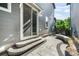 Backyard featuring a stone patio, steps, and landscaped yard at 6940 Clay St, Denver, CO 80221