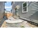 Backyard featuring a stone patio, steps, and landscaped yard at 6940 Clay St, Denver, CO 80221