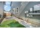 Backyard featuring a stone patio, turf grass, and landscaped yard at 6940 Clay St, Denver, CO 80221