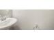 Modern powder room with a pedestal sink at 6940 Clay St, Denver, CO 80221