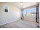 Bright bedroom with carpet, natural light, and a large window at 6940 Clay St, Denver, CO 80221
