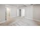 Spacious bedroom with neutral carpet, closet, and ensuite bathroom at 6940 Clay St, Denver, CO 80221