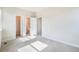 Spacious bedroom with natural light and neutral colors, offering a versatile living space at 6940 Clay St, Denver, CO 80221