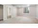 Bright basement bedroom featuring a window, closet, and ensuite bathroom at 6940 Clay St, Denver, CO 80221