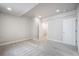 Bright bedroom featuring neutral walls and carpet, with an ensuite bathroom at 6940 Clay St, Denver, CO 80221