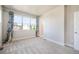 Open concept bedroom with large window offering plenty of sunlight and a neutral color scheme at 6940 Clay St, Denver, CO 80221