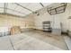 Spacious garage with a large storage rack and shelving at 6940 Clay St, Denver, CO 80221