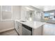 Modern kitchen island with stainless steel dishwasher and plenty of countertop space at 6940 Clay St, Denver, CO 80221
