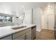 Bright kitchen with large island, open floor plan, and modern fixtures at 6940 Clay St, Denver, CO 80221