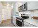 Modern kitchen features stainless steel appliances and white subway tile backsplash at 6940 Clay St, Denver, CO 80221