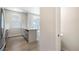 View of the kitchen island that leads to the powder room at 6940 Clay St, Denver, CO 80221