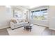 Bright living room with modern decor, large windows, and comfortable seating area at 6940 Clay St, Denver, CO 80221
